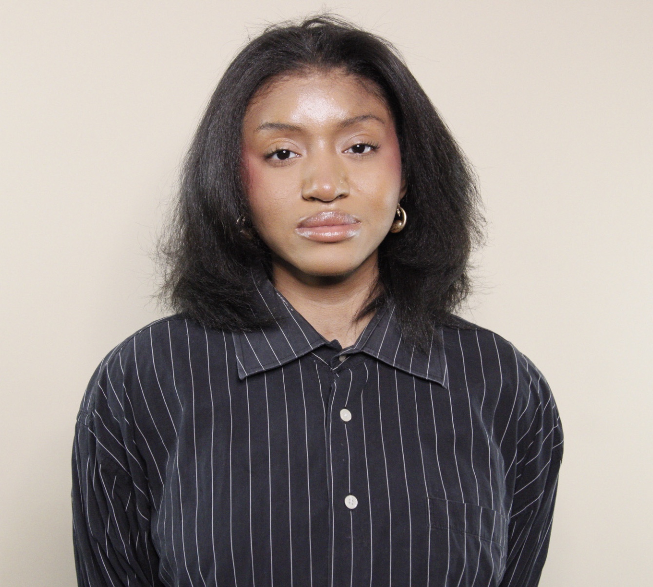 Portrait photo of Queen Carrasco.
