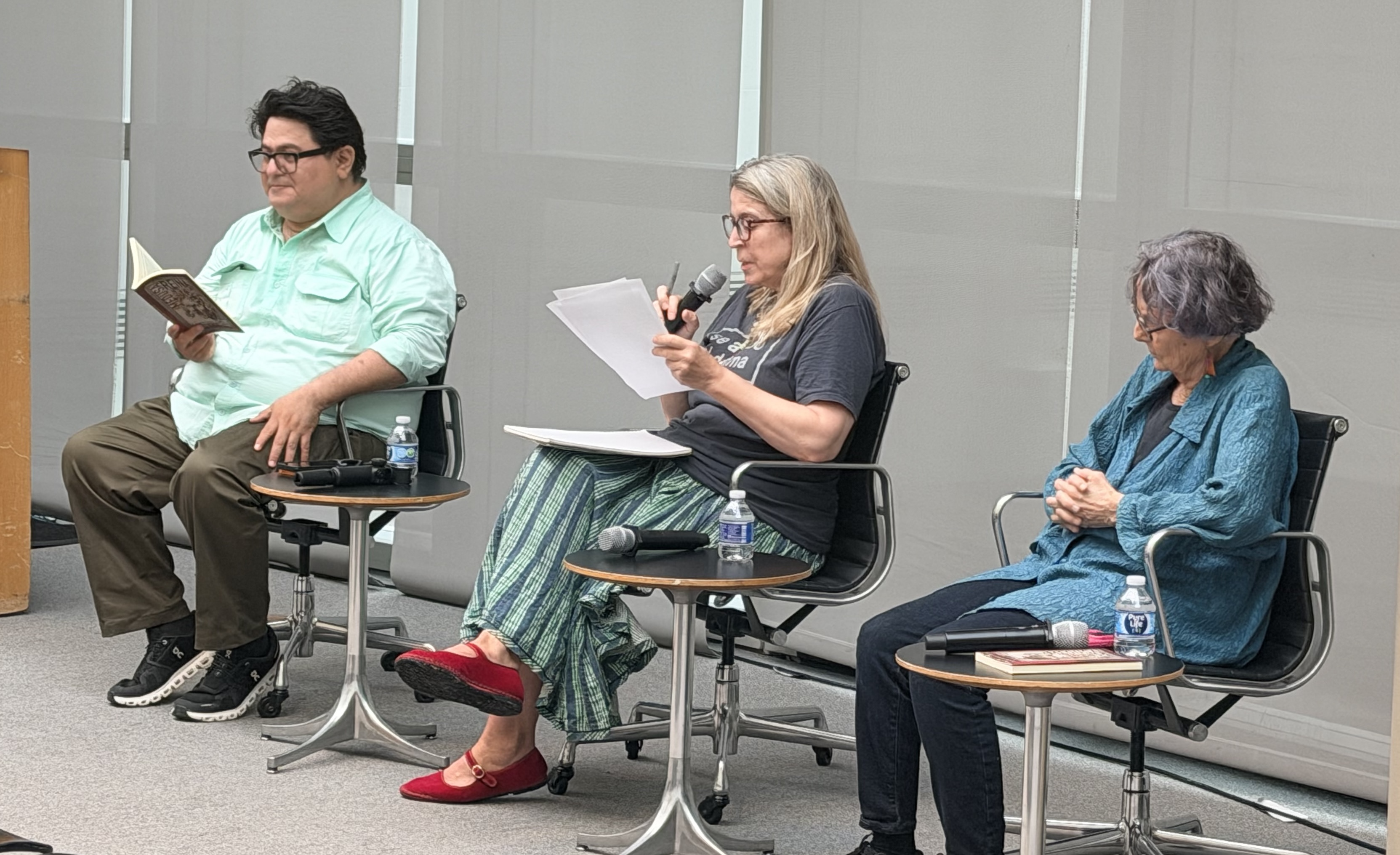 three people sitting in three chairs