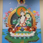A thangka of White Tara hanging in the CUNY BA Office
