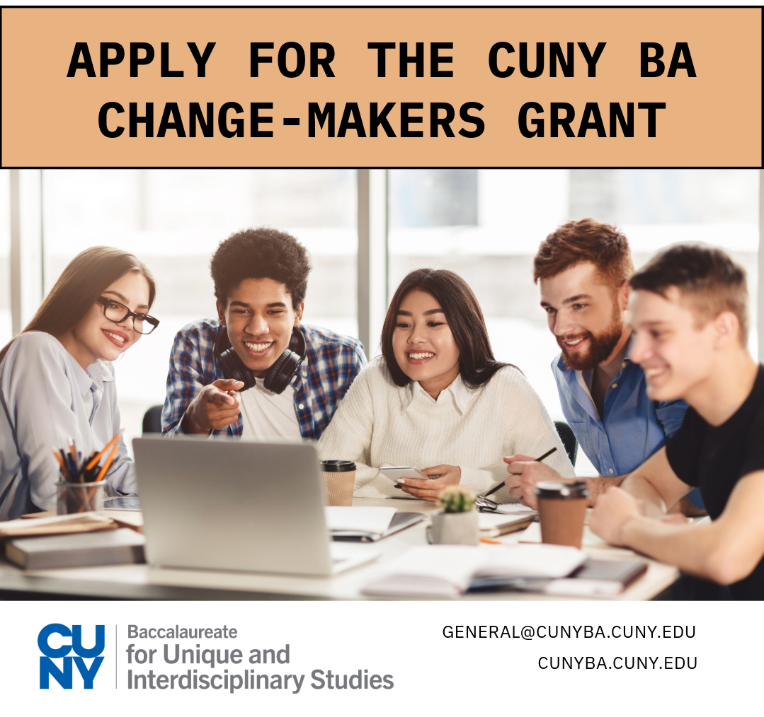 students at a desk with a laptop