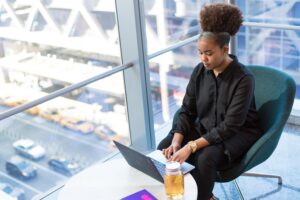 woman laptop window