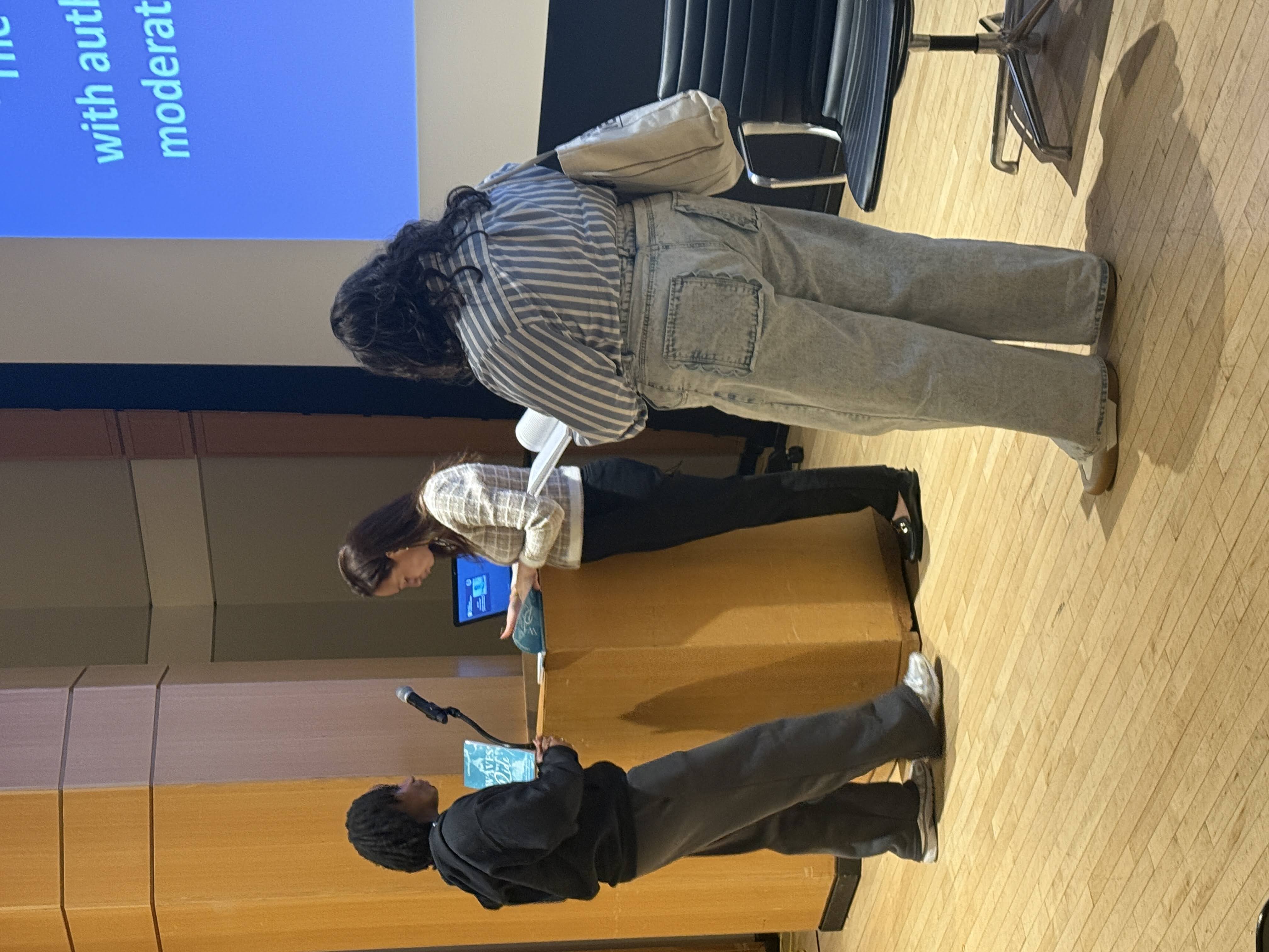 people standing at a podium