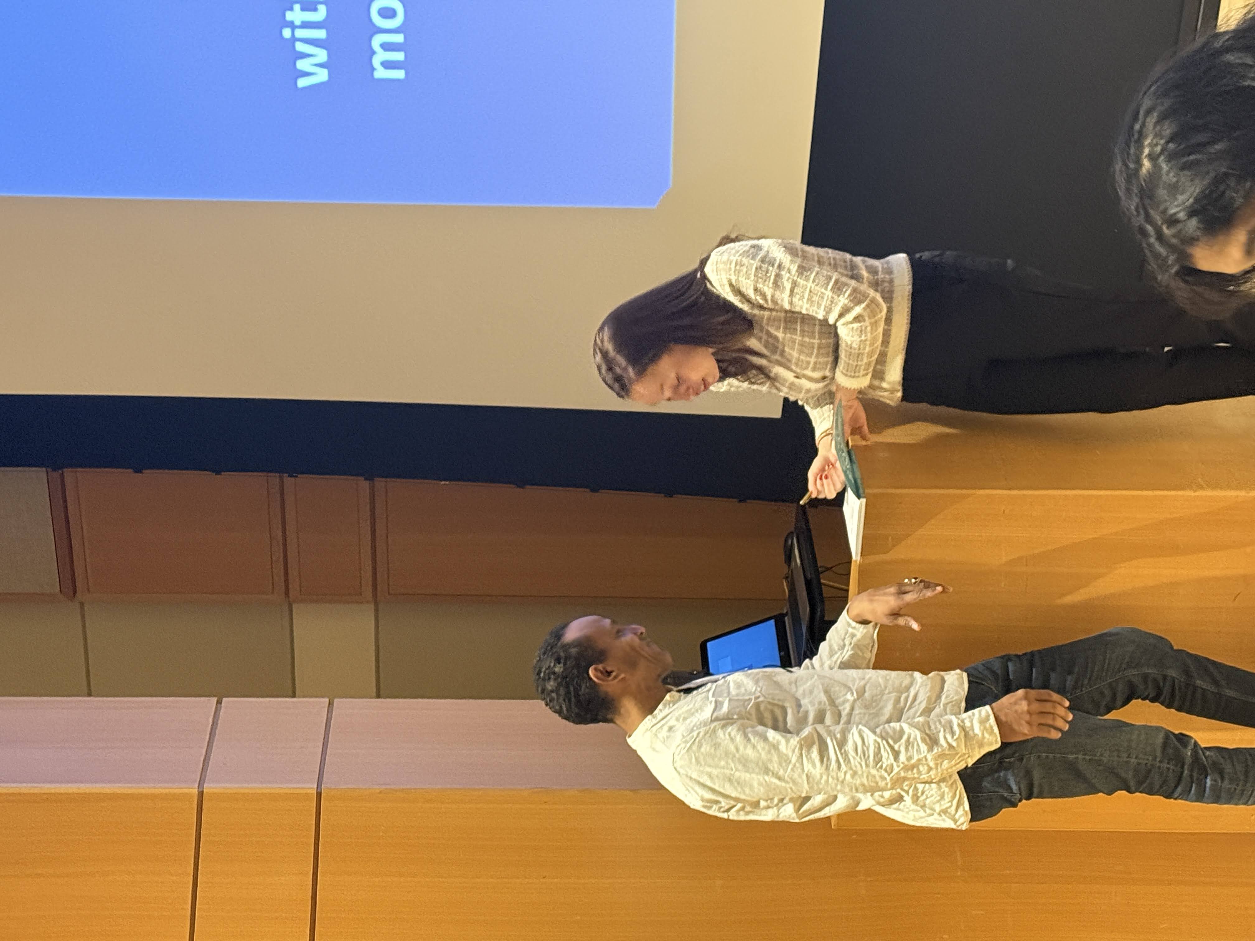 two people standing at a podium