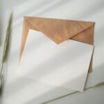 blank card over beige envelope